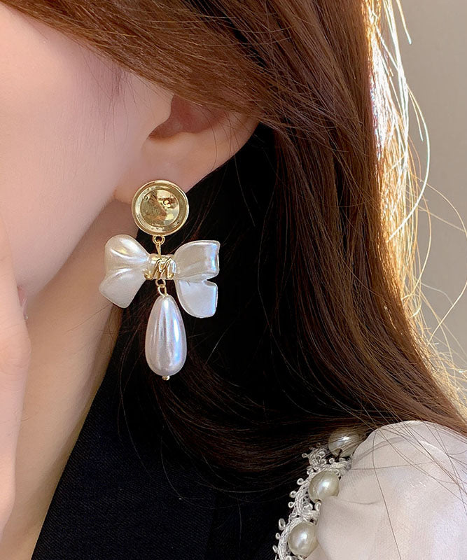 White Copper Alloy Pearl Bow Drop Earrings