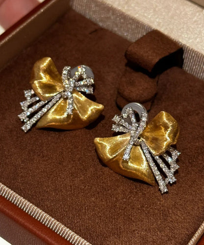 Gold Copper Zircon Asymmetrical Bow Stud Earrings