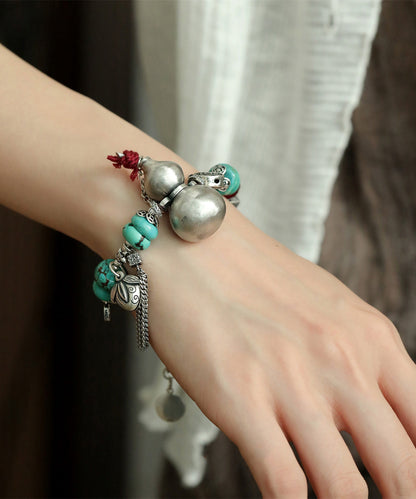 Silk Sterling Silver Calabash Turquoise Charm Bracelet