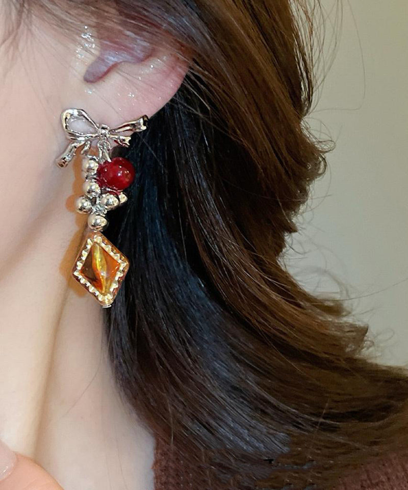 Acrylic Alloy Asymmetrical Amber Bow Tassel Drop Earrings