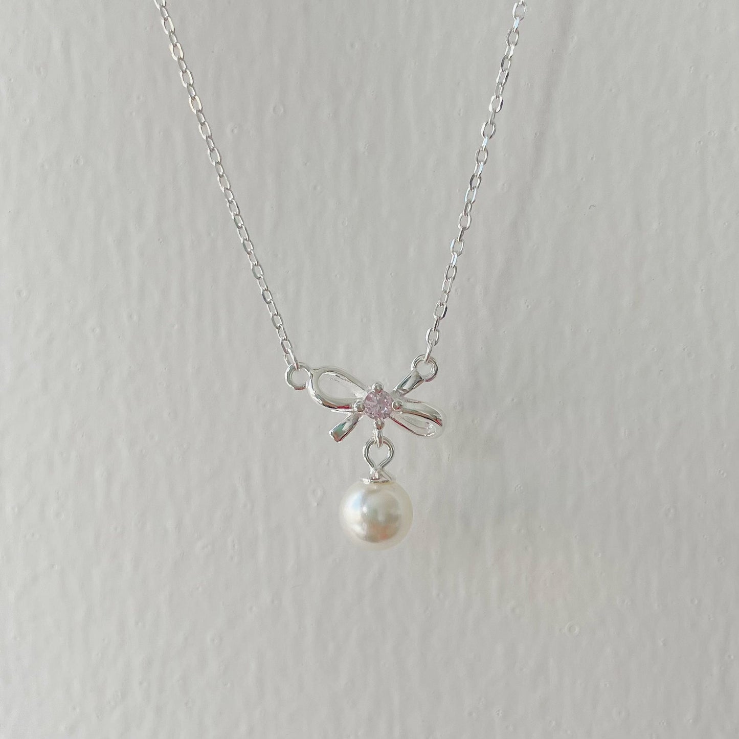 Cady Bow and Pearl Necklace